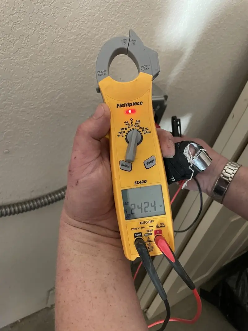 Voltage testing with clamp meter during Outlet Installation in Park Hills